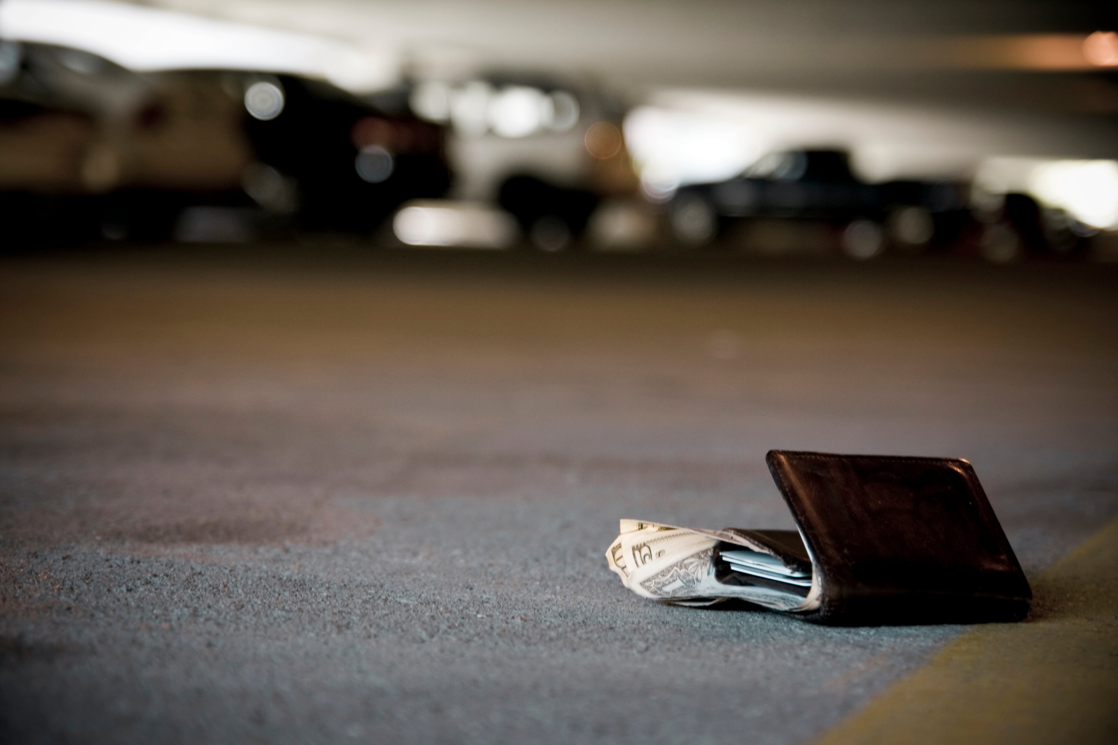Lost wallet on the ground of a carpark